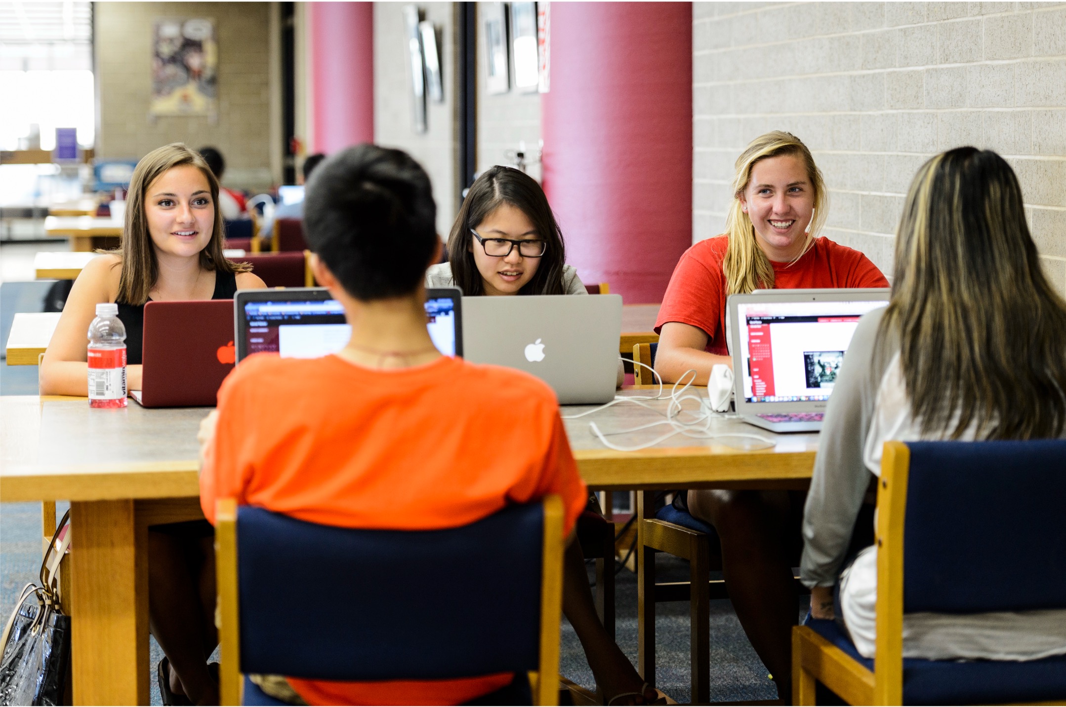 A group of 5 students working on a project